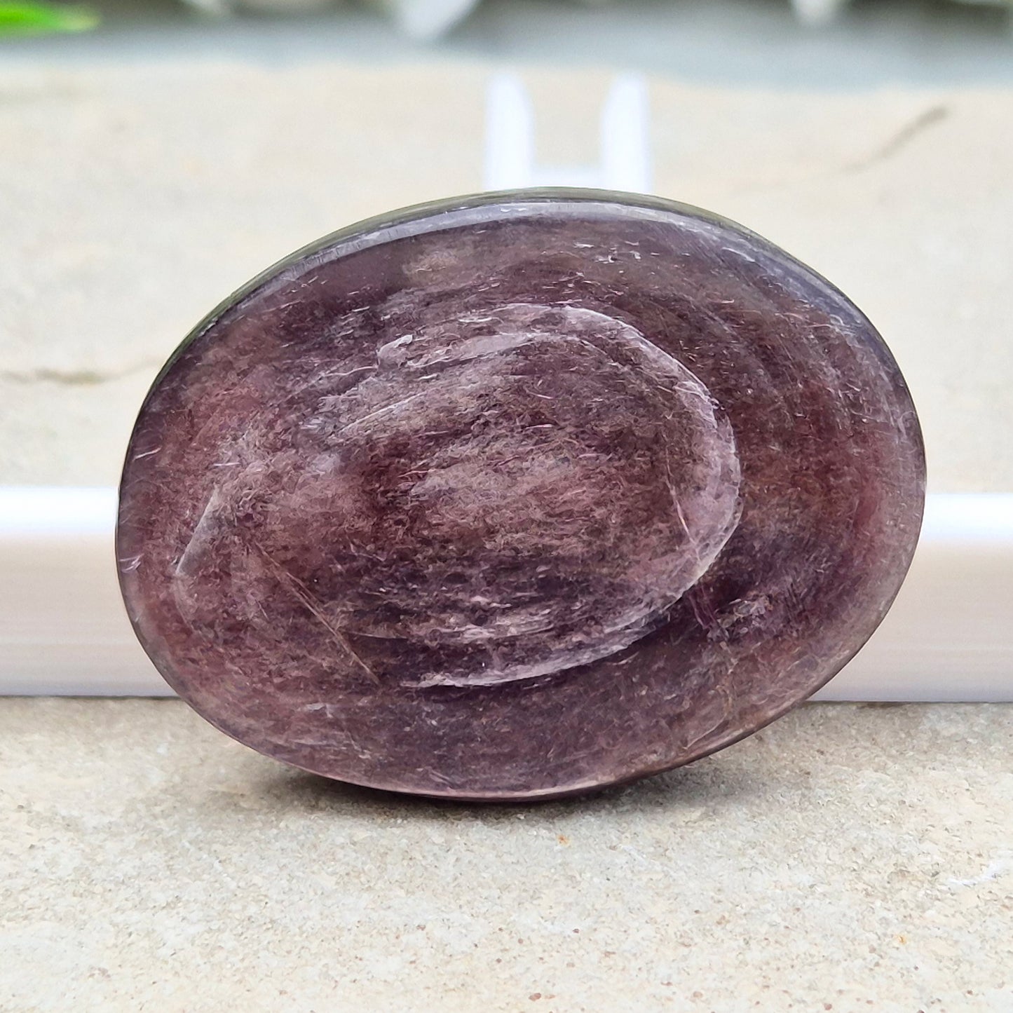 Mica palm stone in shimmering metallic lilac. Perfect for holding, mindful energy, and gifting. Helps steady thoughts, balance emotions, and uplift.