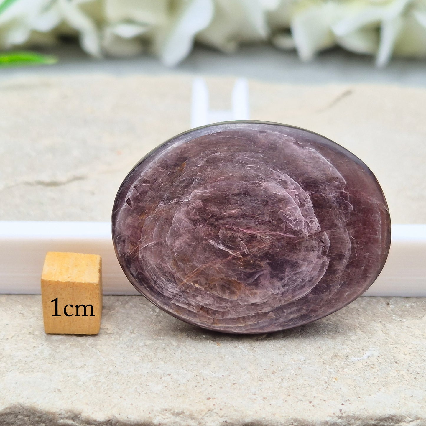Mica palm stone in shimmering metallic lilac. Perfect for holding, mindful energy, and gifting. Helps steady thoughts, balance emotions, and uplift.