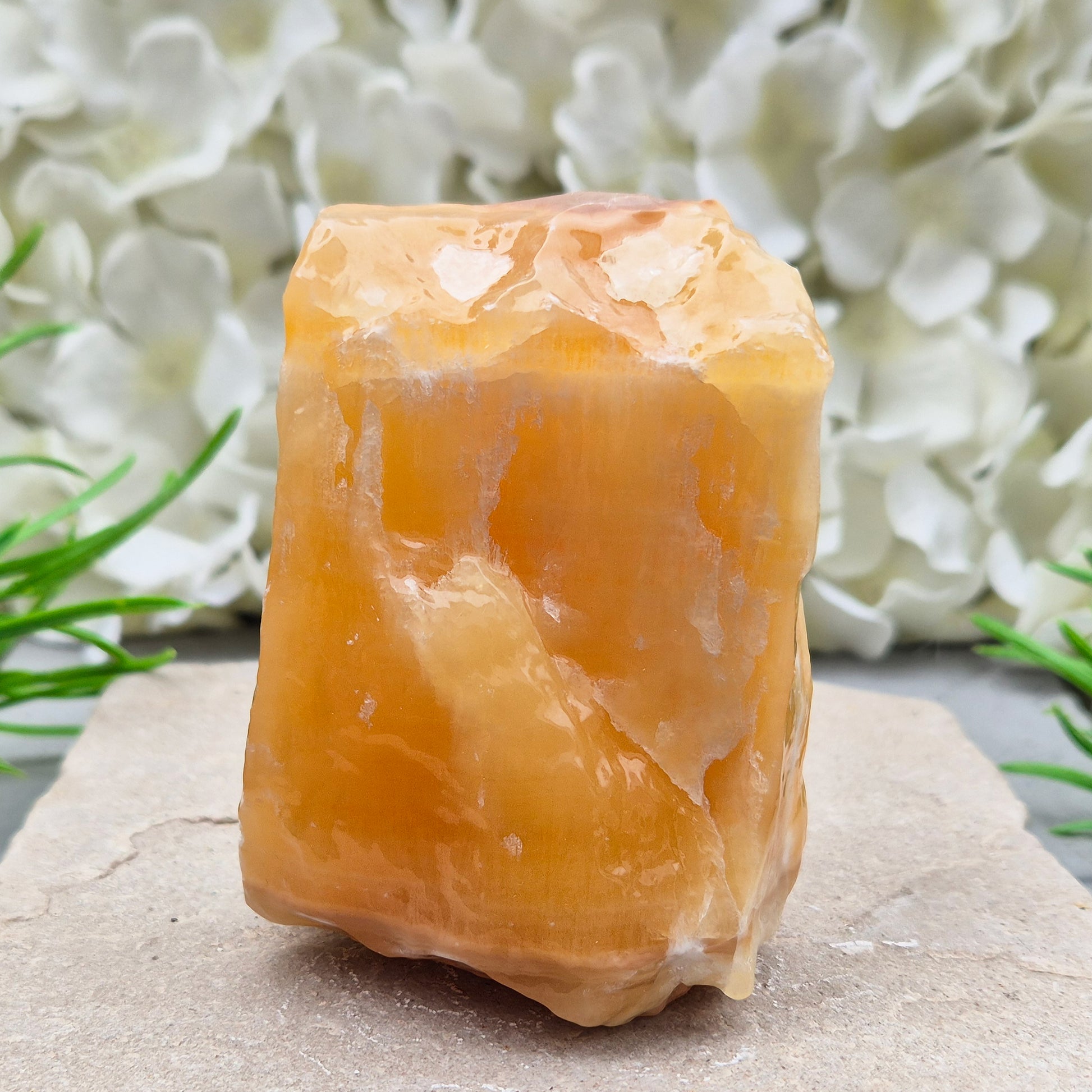 Natural Orange Calcite standing stone from Mexico. A warm, uplifting crystal for motivation, confidence, and brighter, more energised spaces.