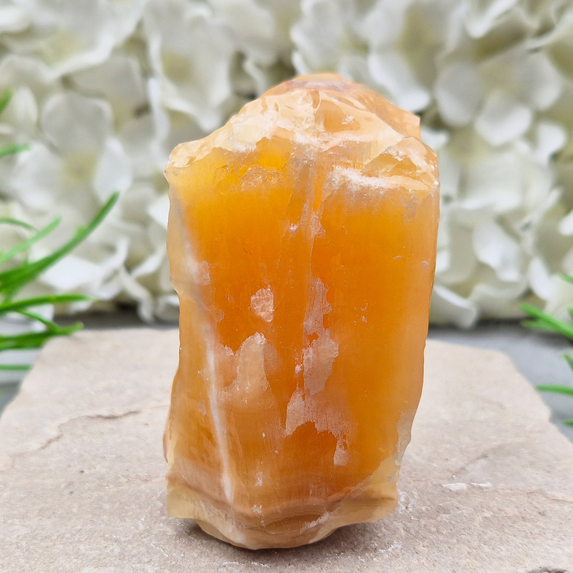 Natural Orange Calcite standing stone from Mexico. A warm, uplifting crystal for motivation, confidence, and brighter, more energised spaces.