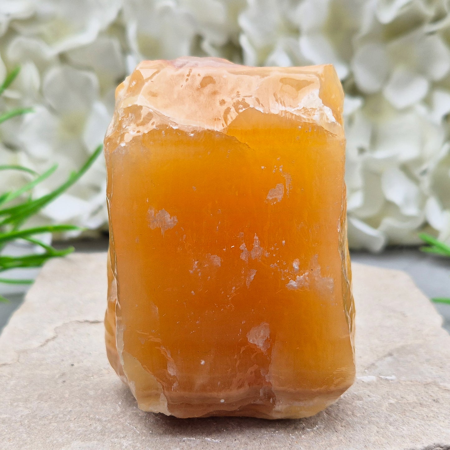 Natural Orange Calcite standing stone from Mexico. A warm, uplifting crystal for motivation, confidence, and brighter, more energised spaces.
