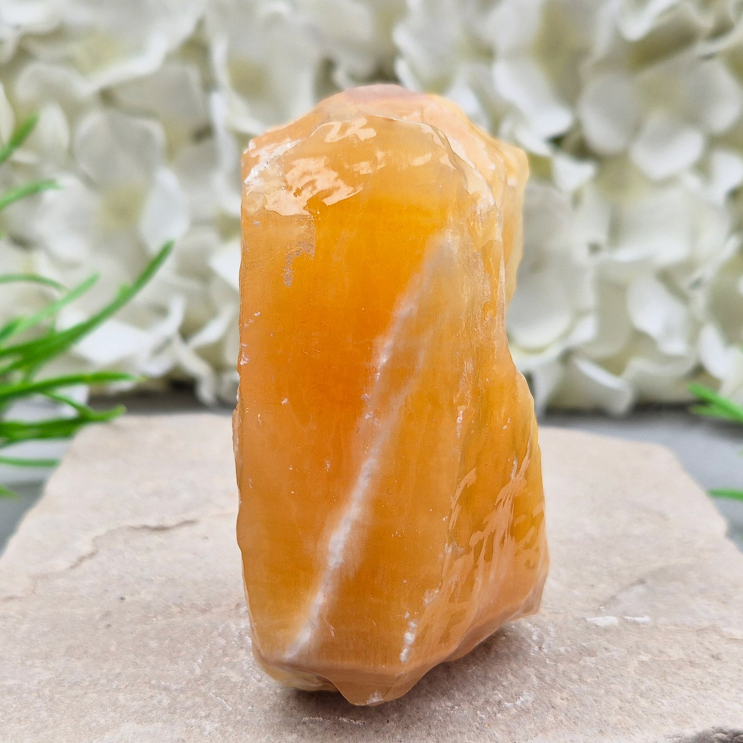 Natural Orange Calcite standing stone from Mexico. A warm, uplifting crystal for motivation, confidence, and brighter, more energised spaces.