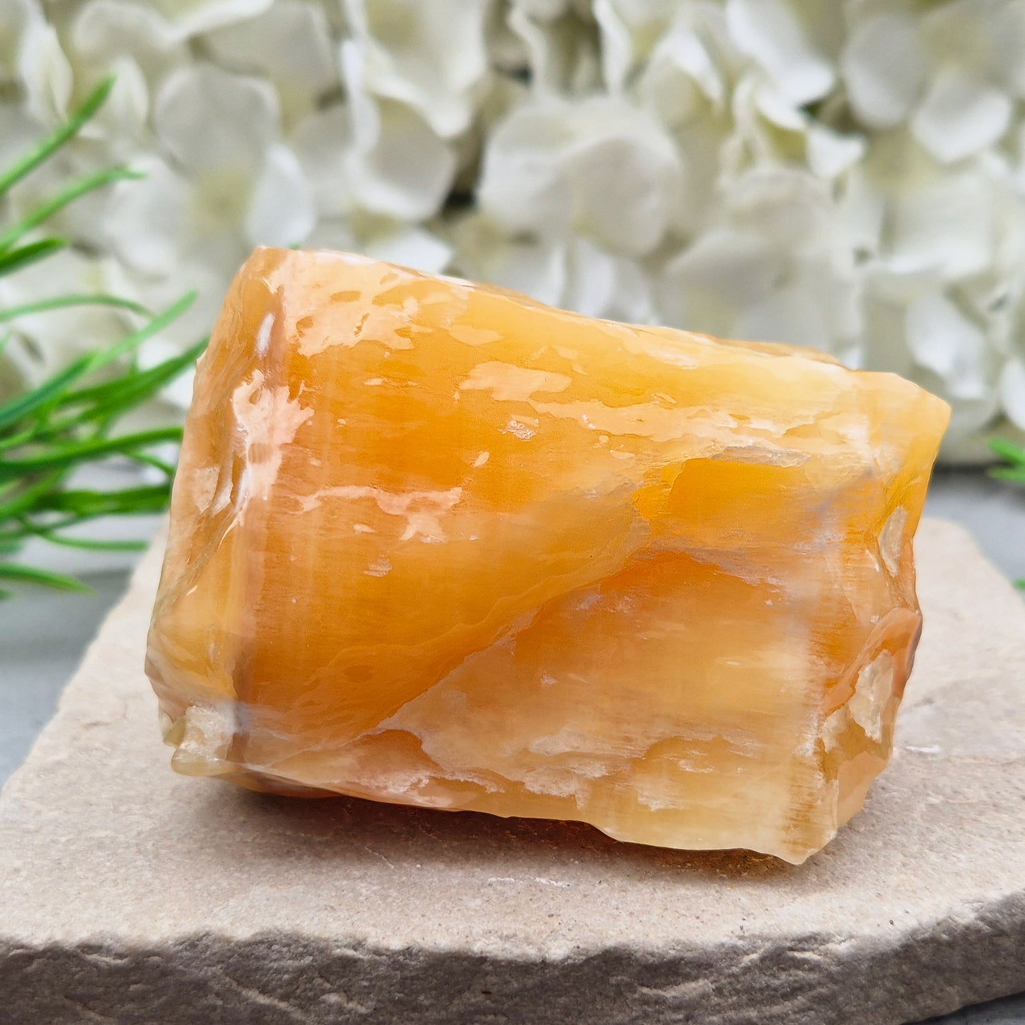 Natural Orange Calcite standing stone from Mexico. A warm, uplifting crystal for motivation, confidence, and brighter, more energised spaces.