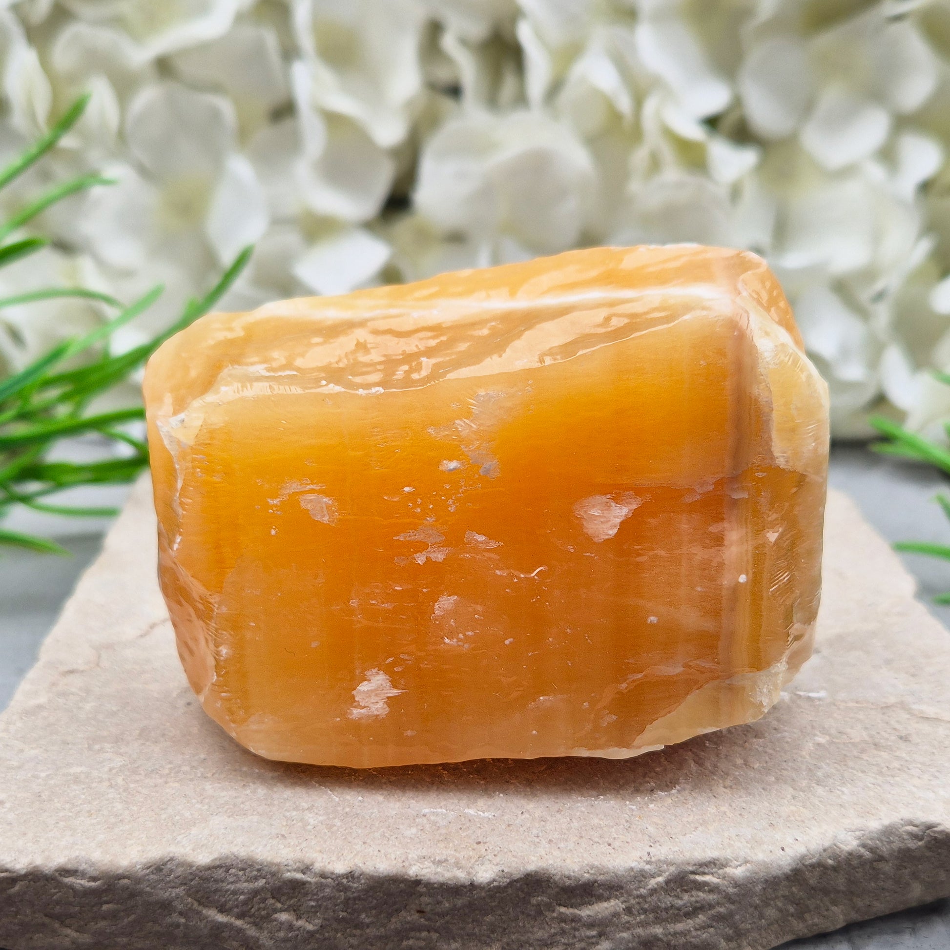 Natural Orange Calcite standing stone from Mexico. A warm, uplifting crystal for motivation, confidence, and brighter, more energised spaces.