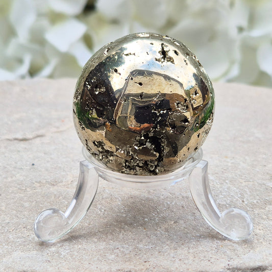 genuine Pyrite crystal sphere from Peru. Known for confidence, motivation, protection, abundance, and energising workspace energy.