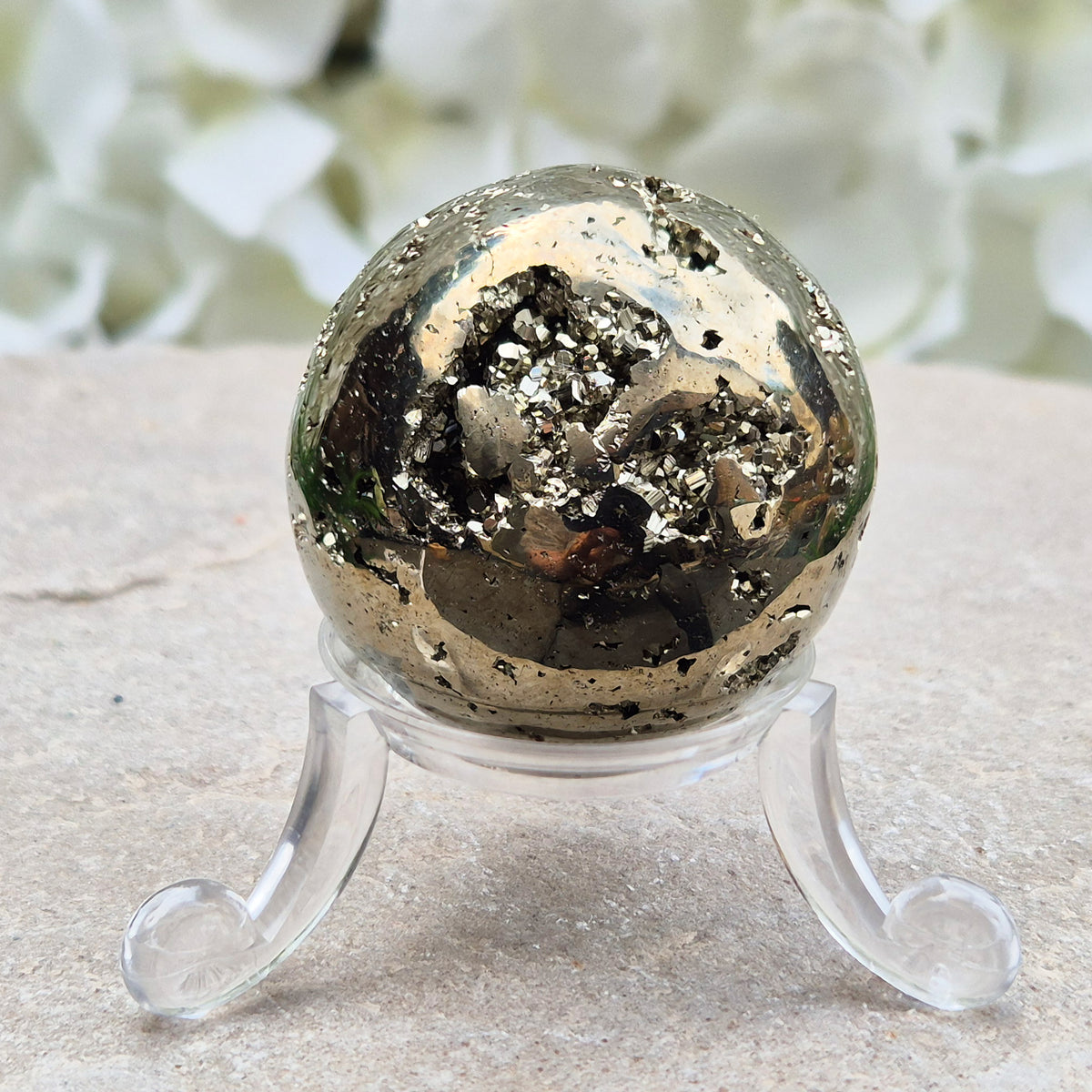 genuine Pyrite crystal sphere from Peru. Known for confidence, motivation, protection, abundance, and energising workspace energy.