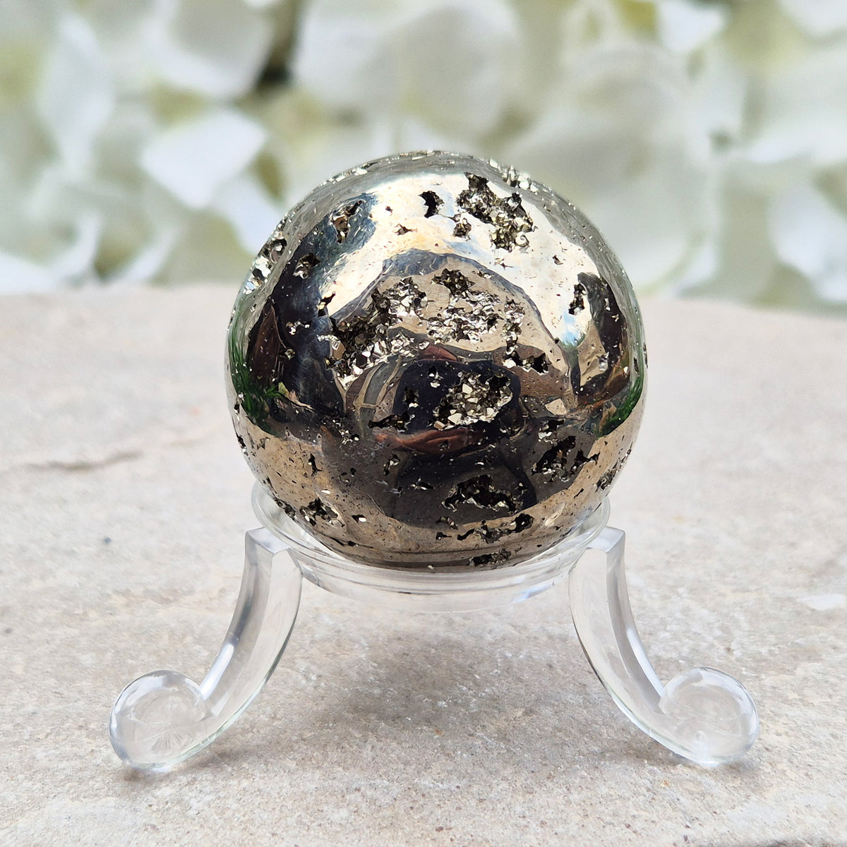 genuine Pyrite crystal sphere from Peru. Known for confidence, motivation, protection, abundance, and energising workspace energy.
