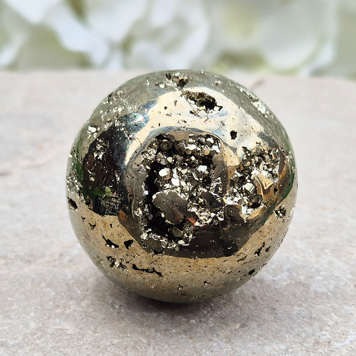 genuine Pyrite crystal sphere from Peru. Known for confidence, motivation, protection, abundance, and energising workspace energy.