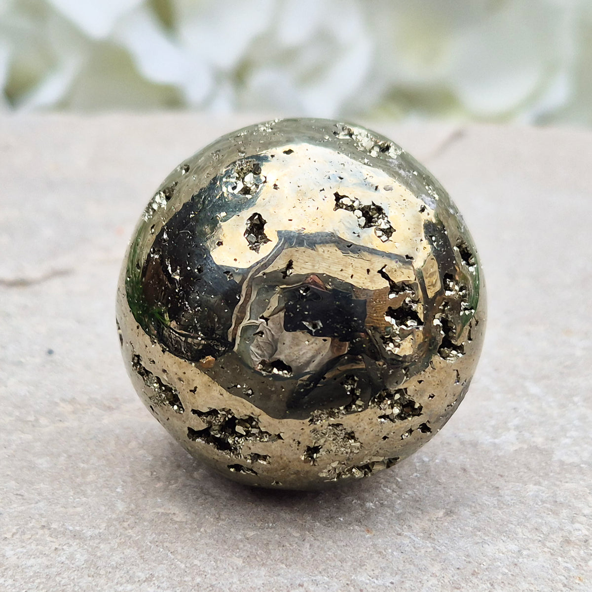 genuine Pyrite crystal sphere from Peru. Known for confidence, motivation, protection, abundance, and energising workspace energy.