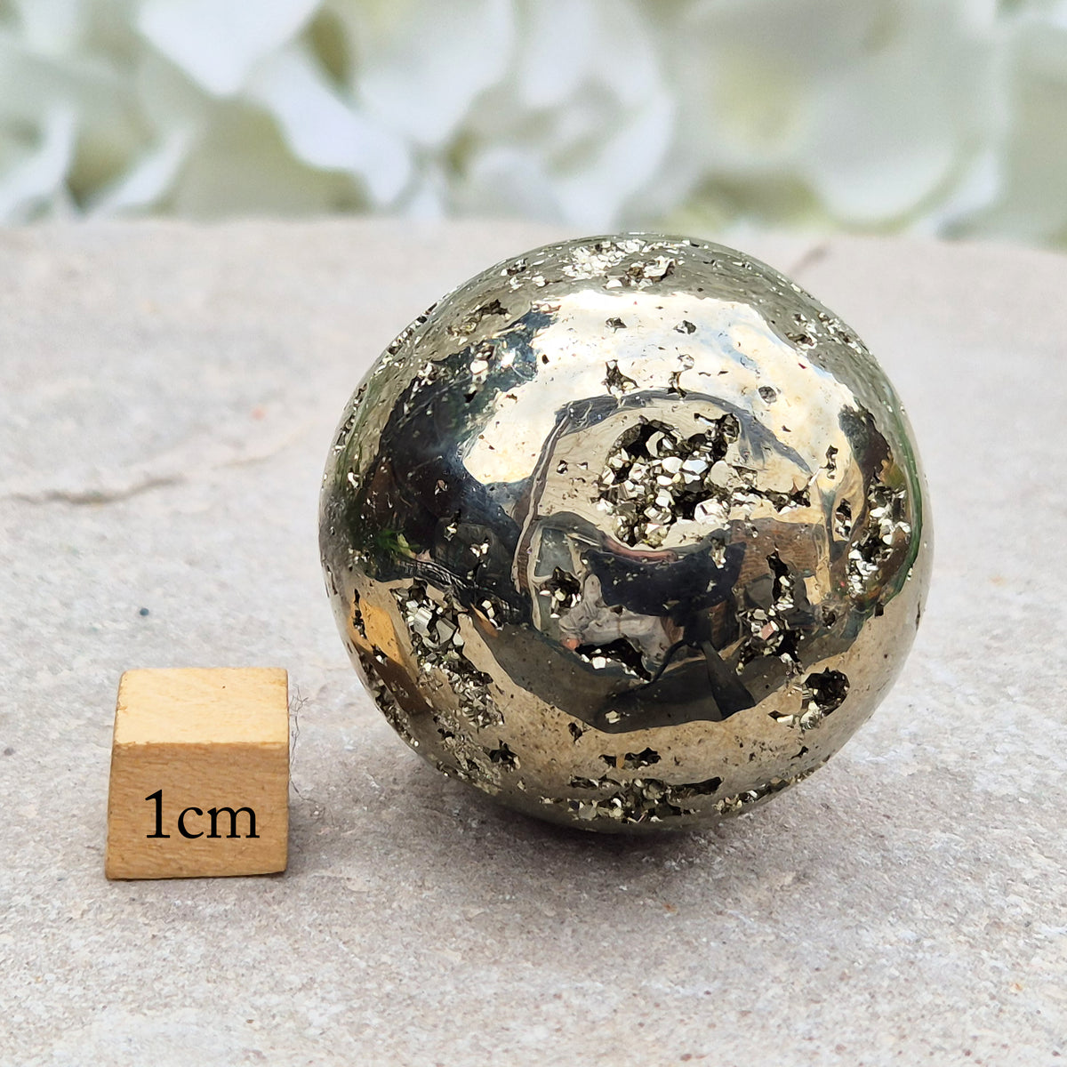 genuine Pyrite crystal sphere from Peru. Known for confidence, motivation, protection, abundance, and energising workspace energy.