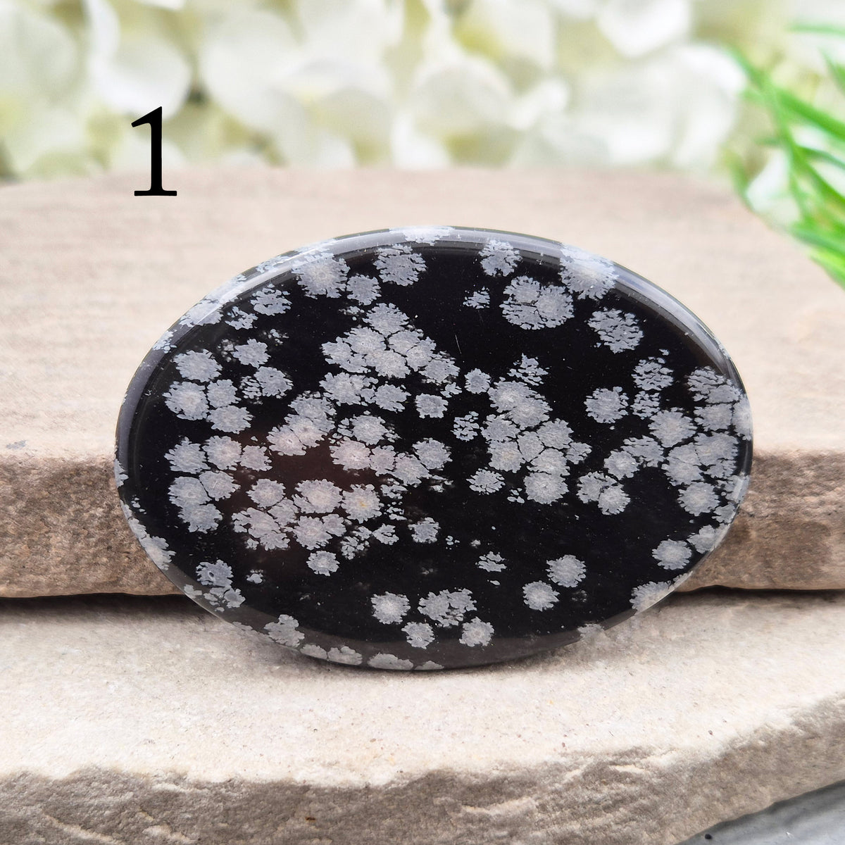 Snowflake Obsidian Palm Stone – grounding crystal for emotional balance, breaking patterns, steady protection. Smooth polished palm stone for everyday use.