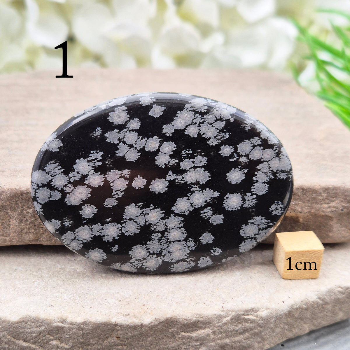 Snowflake Obsidian Palm Stone – grounding crystal for emotional balance, breaking patterns, steady protection. Smooth polished palm stone for everyday use.