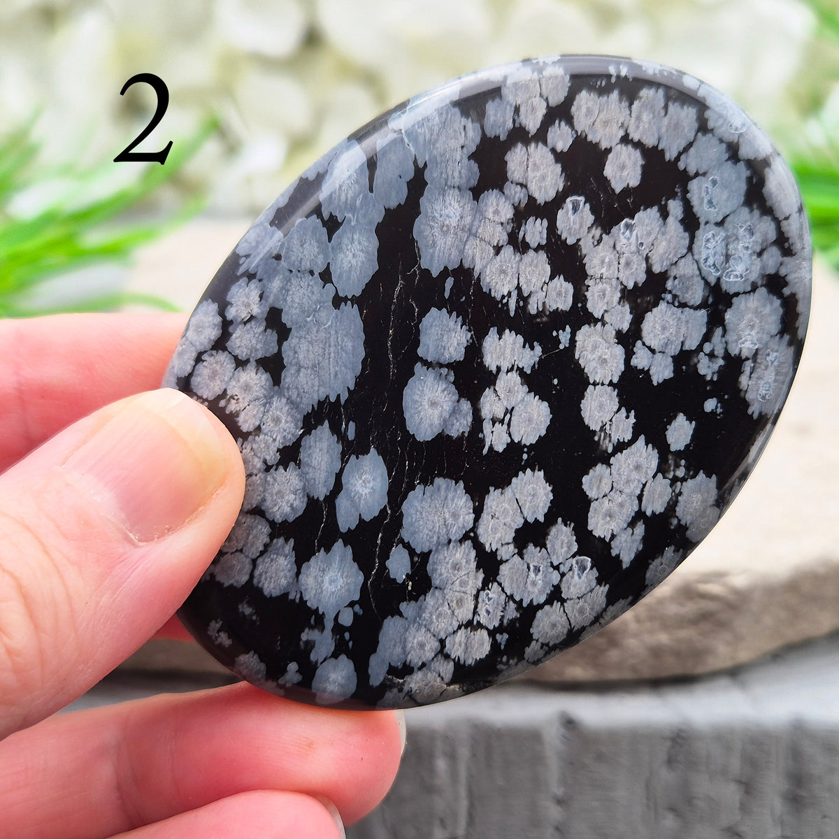 Snowflake Obsidian Palm Stone – grounding crystal for emotional balance, breaking patterns, steady protection. Smooth polished palm stone for everyday use.