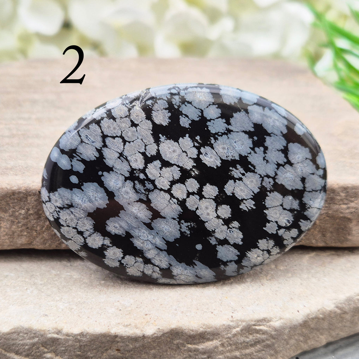 Snowflake Obsidian Palm Stone – grounding crystal for emotional balance, breaking patterns, steady protection. Smooth polished palm stone for everyday use.