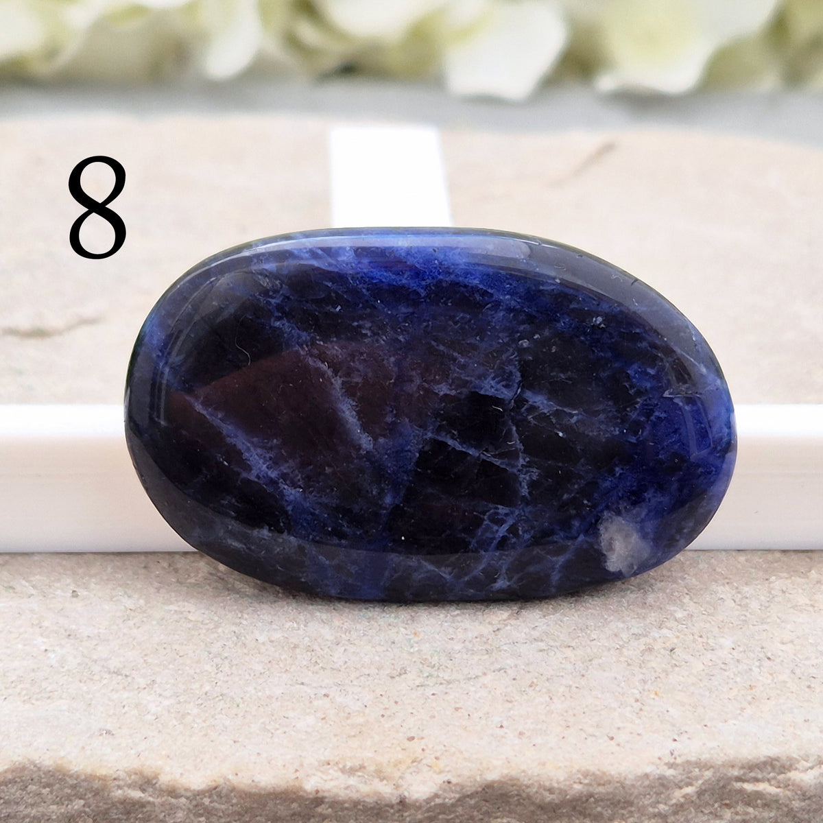 Beautiful A-grade Sodalite palm stone from Namibia. Supports clear thinking, confidence in communication, and emotional calm. Throat & Third Eye chakra crystal.