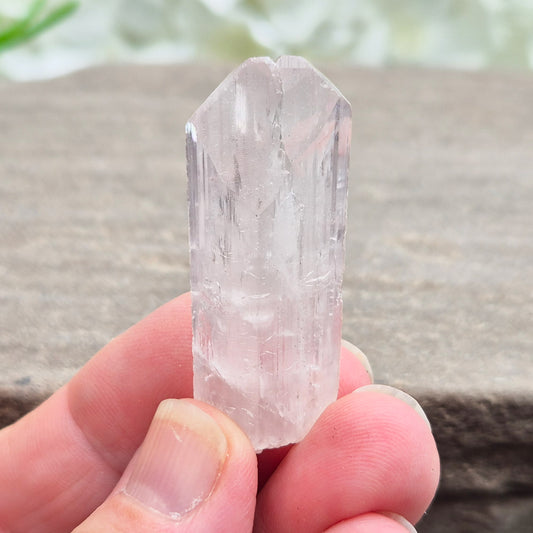 Natural Danburite crystal from Charcas, Mexico, with bright clarity and light-reflecting inclusions.