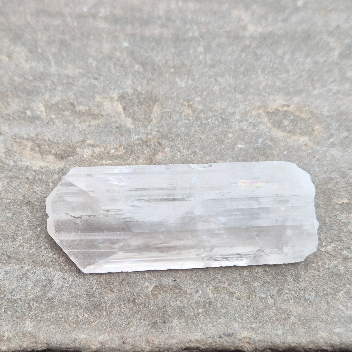 Natural Danburite crystal from Charcas, Mexico, with bright clarity and light-reflecting inclusions.