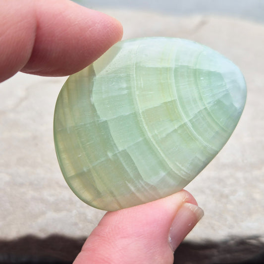 Pistachio Green Calcite palm stone soothes, restores balance, and encourages renewal. Perfect for meditation, emotional healing, and fresh energy flow.