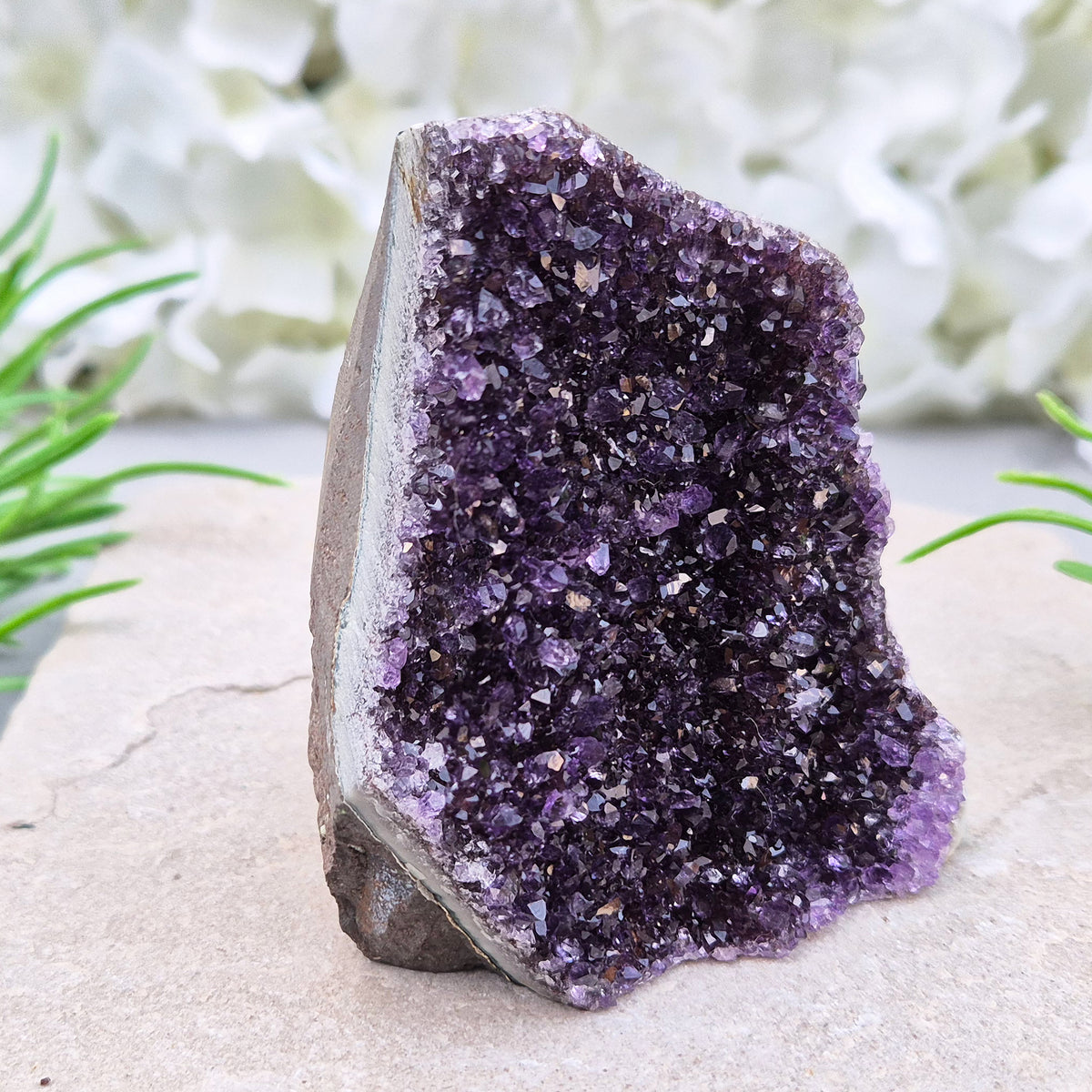 Amethyst geode with sparkling deep purple points from Brazil. A self-standing display piece offering calm, clarity, protection, and strong spiritual presence.