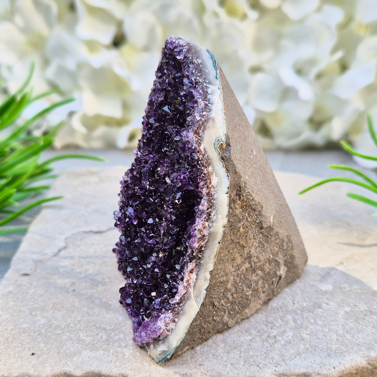 Amethyst geode with sparkling deep purple points from Brazil. A self-standing display piece offering calm, clarity, protection, and strong spiritual presence.
