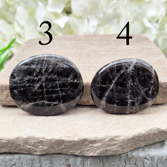 Black Moonstone Crystal Palm Stone, valued for its connection to the moon’s energy. Perfect for enhancing intuition, emotional healing, and balancing energy.