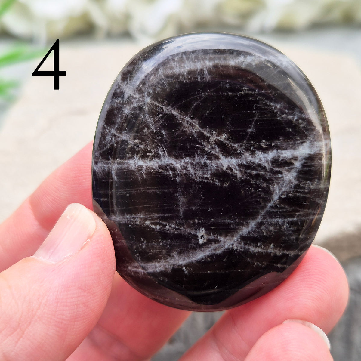 Black Moonstone Crystal Palm Stone, valued for its connection to the moon’s energy. Perfect for enhancing intuition, emotional healing, and balancing energy.