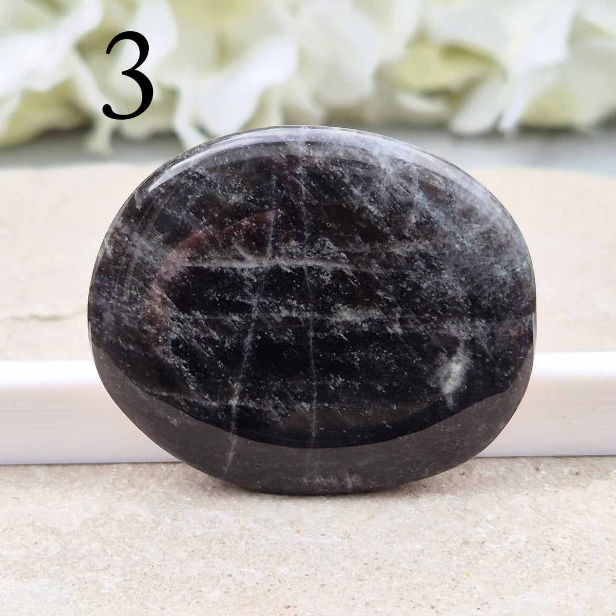Black Moonstone Crystal Palm Stone, valued for its connection to the moon’s energy. Perfect for enhancing intuition, emotional healing, and balancing energy.