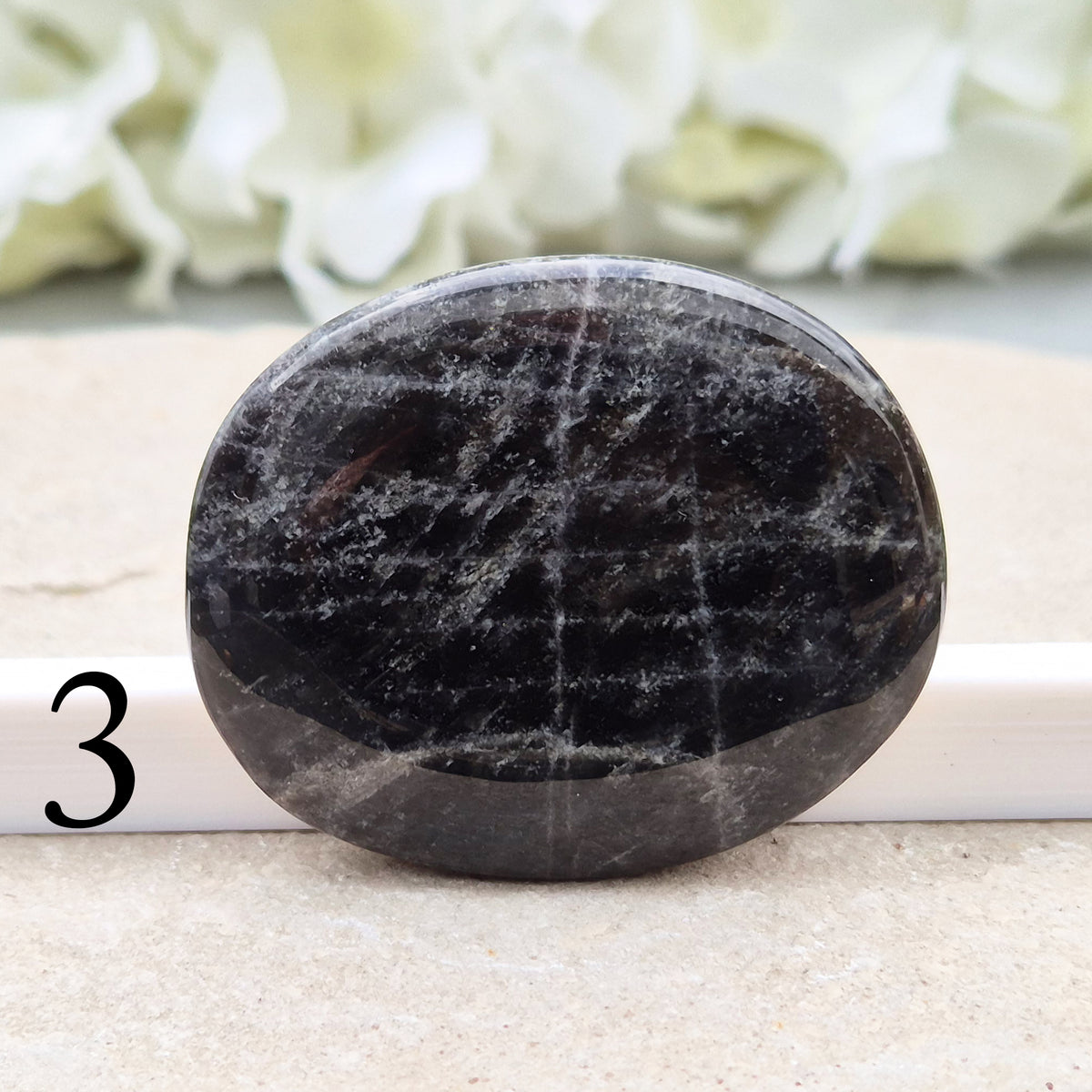Black Moonstone Crystal Palm Stone, valued for its connection to the moon’s energy. Perfect for enhancing intuition, emotional healing, and balancing energy.