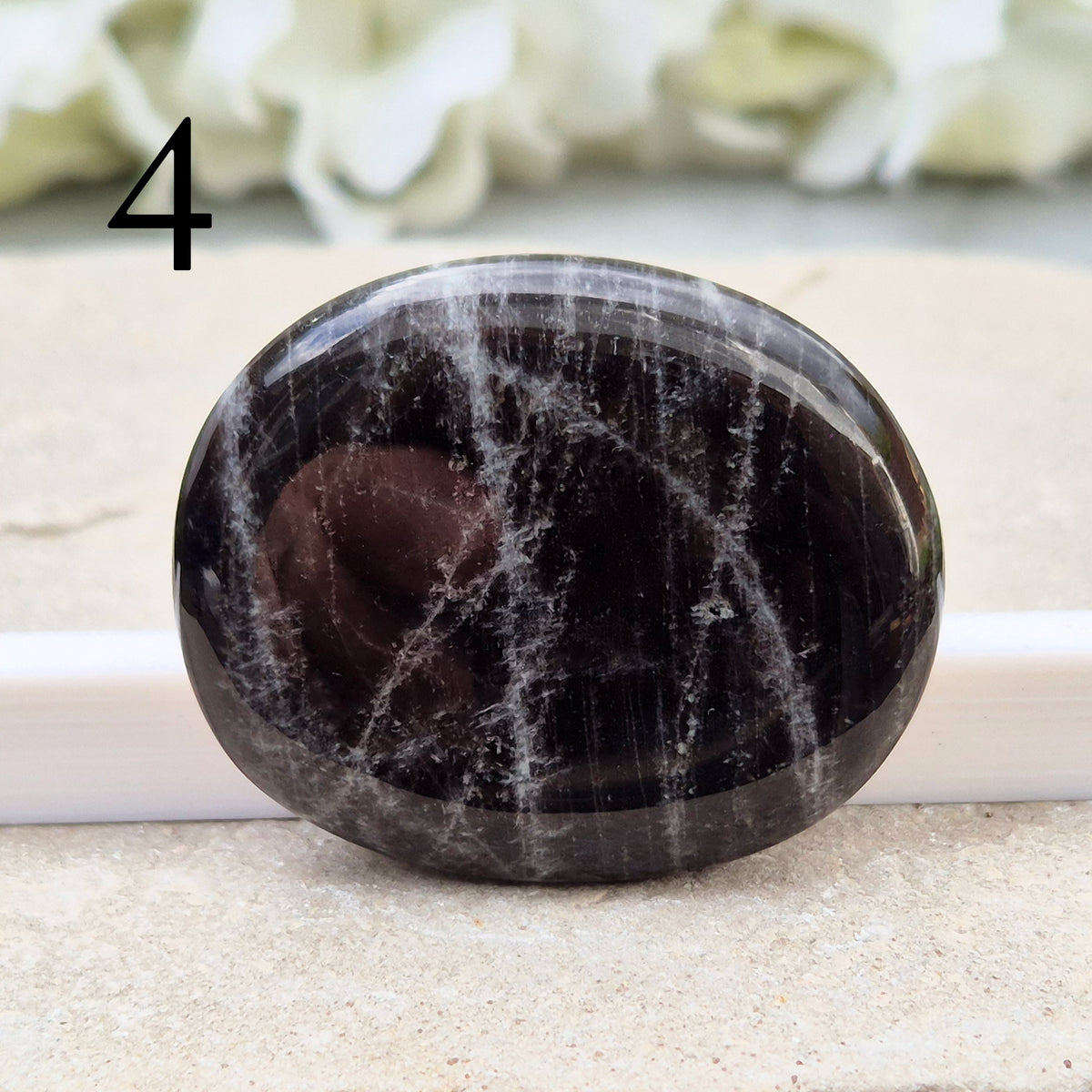 Black Moonstone Crystal Palm Stone, valued for its connection to the moon’s energy. Perfect for enhancing intuition, emotional healing, and balancing energy.
