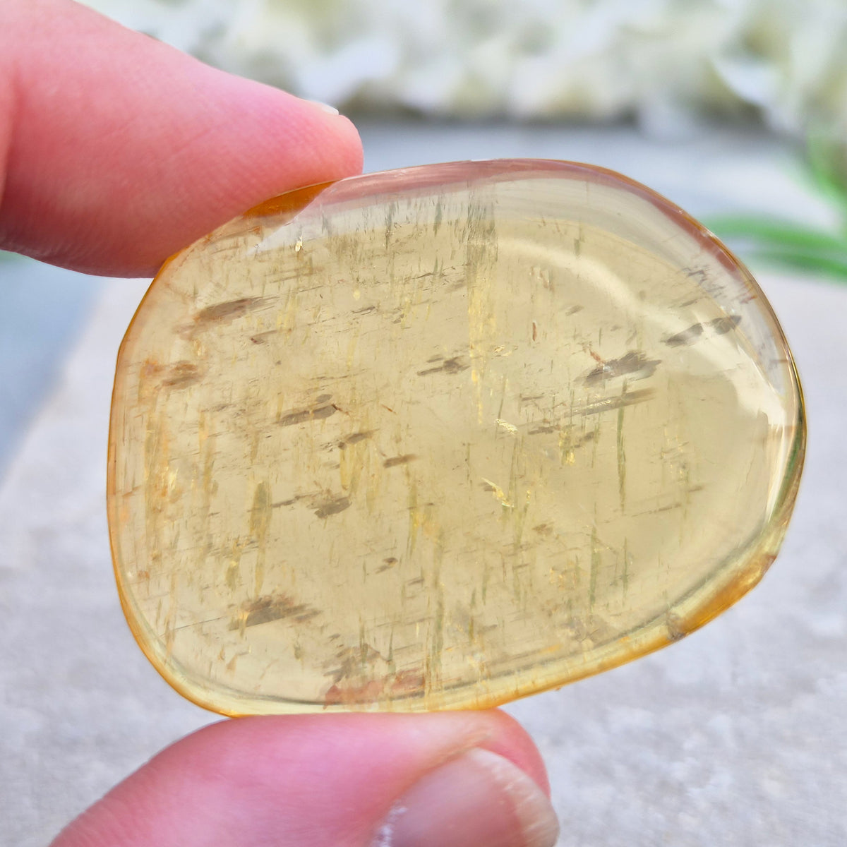 Honey Calcite Palm Stone – warm golden-amber crystal, polished for meditation & pocket carry.
