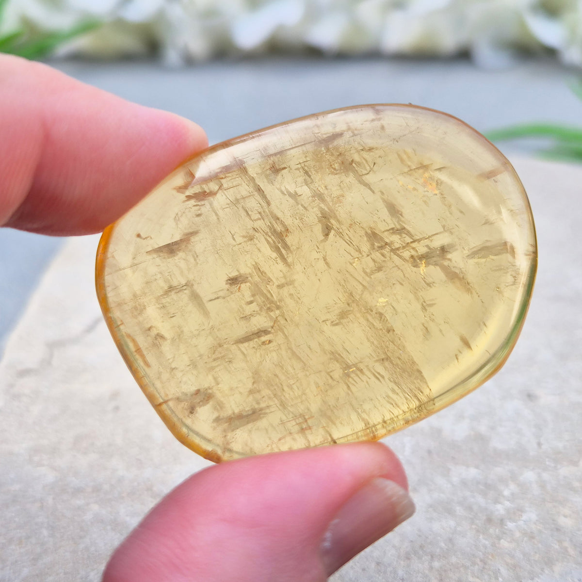 Honey Calcite Palm Stone – warm golden-amber crystal, polished for meditation & pocket carry.