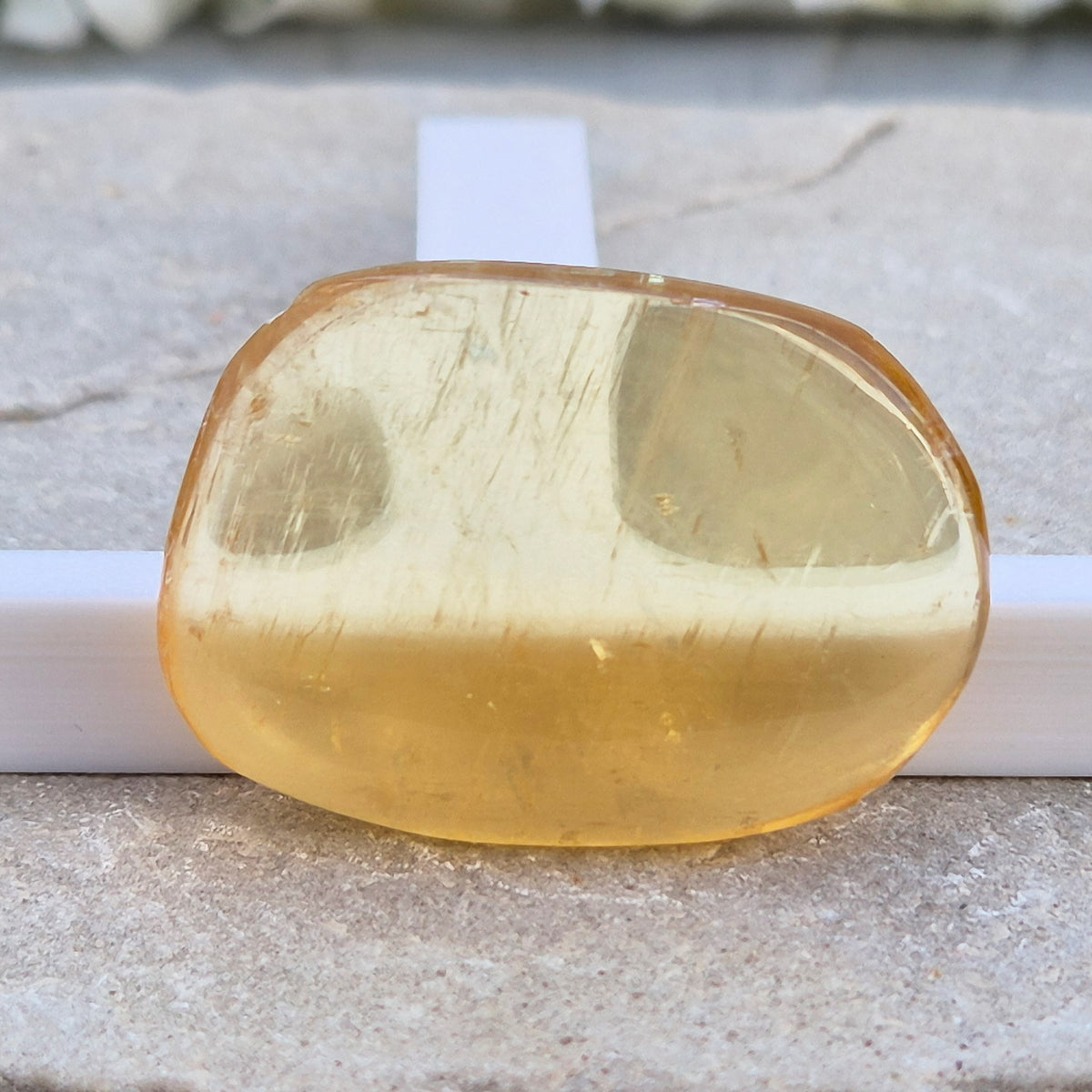 Honey Calcite Palm Stone – warm golden-amber crystal, polished for meditation & pocket carry.