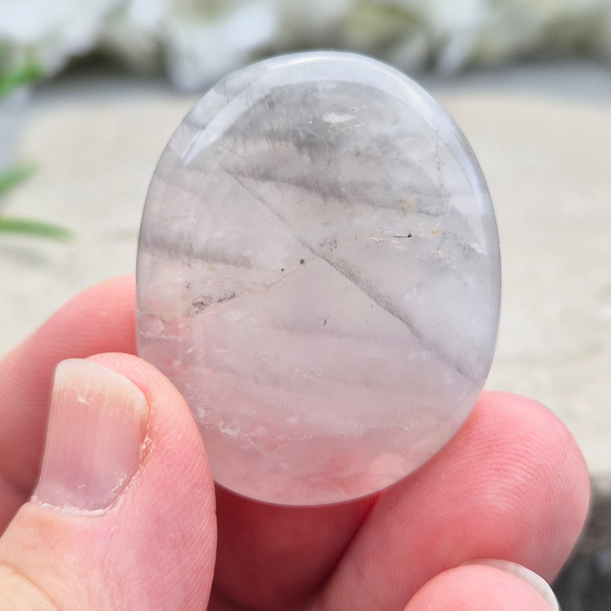 Shop Lunar Quartz palm stones. Boost confidence, ease emotions, and feel more connected to your inner guidance with this soothing crystal.