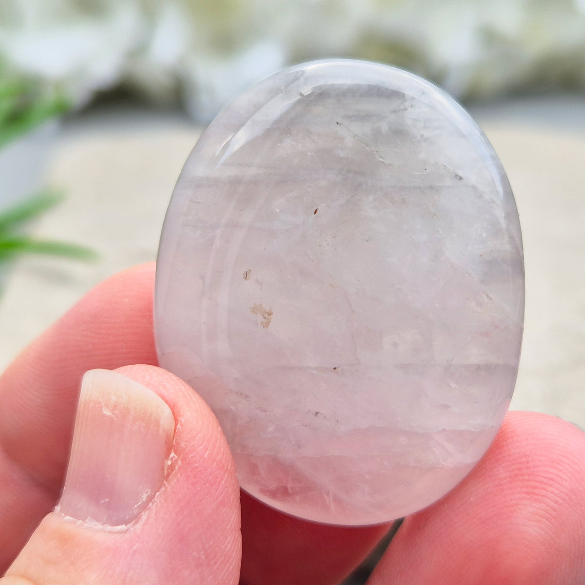 Shop Lunar Quartz palm stones. Boost confidence, ease emotions, and feel more connected to your inner guidance with this soothing crystal.