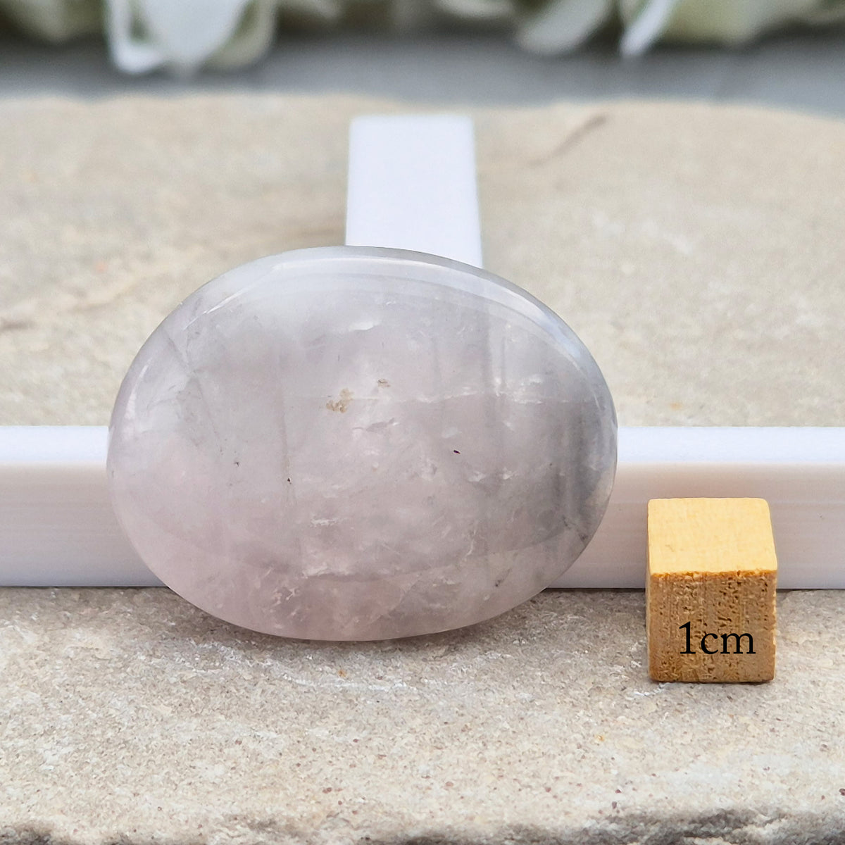 Shop Lunar Quartz palm stones. Boost confidence, ease emotions, and feel more connected to your inner guidance with this soothing crystal.