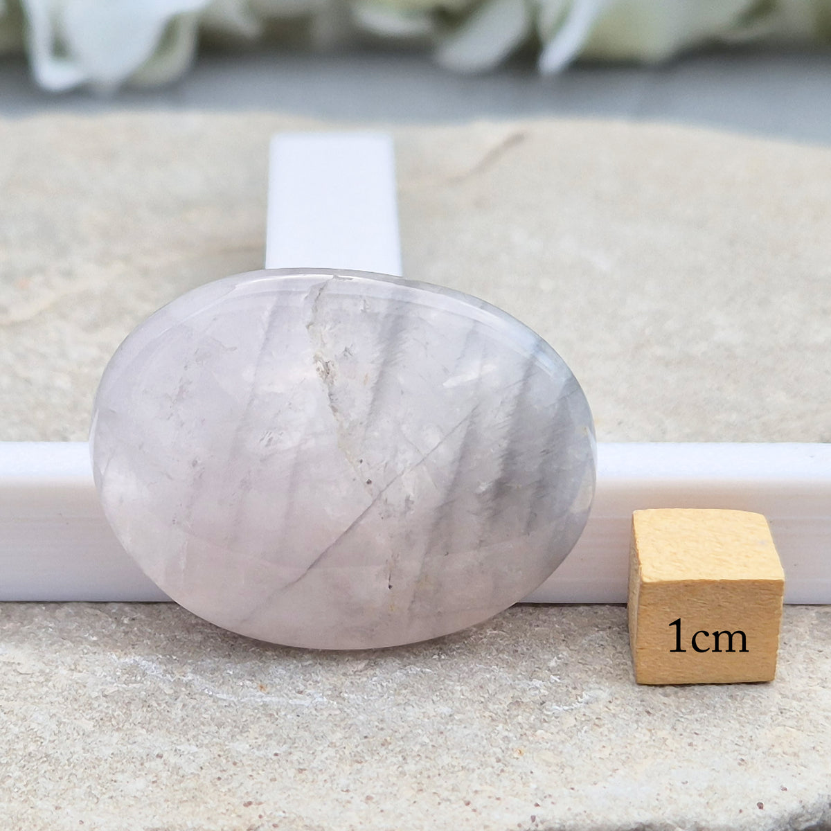 Shop Lunar Quartz palm stones. Boost confidence, ease emotions, and feel more connected to your inner guidance with this soothing crystal.