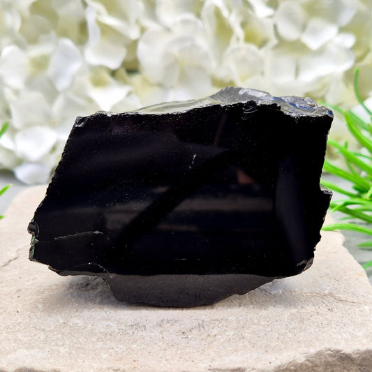 Natural black obsidian freeform from Mexico, known for its grounding presence and protective energy. A striking volcanic glass piece.
