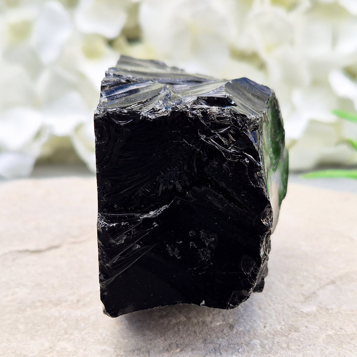 Natural black obsidian freeform from Mexico, known for its grounding presence and protective energy. A striking volcanic glass piece.