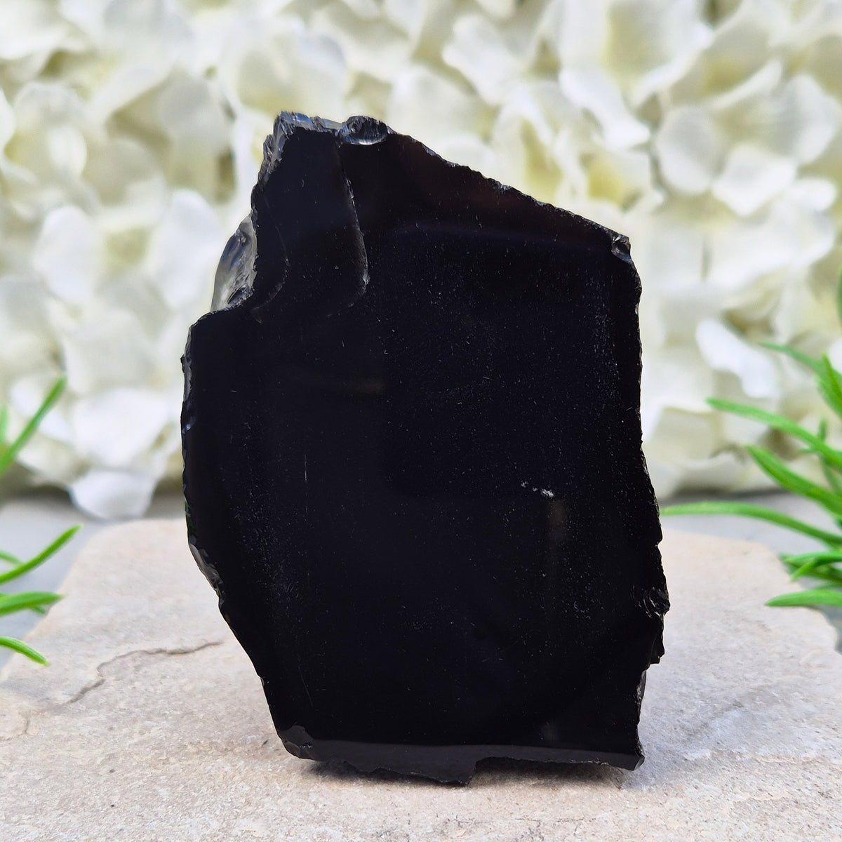 Natural black obsidian freeform from Mexico, known for its grounding presence and protective energy. A striking volcanic glass piece.