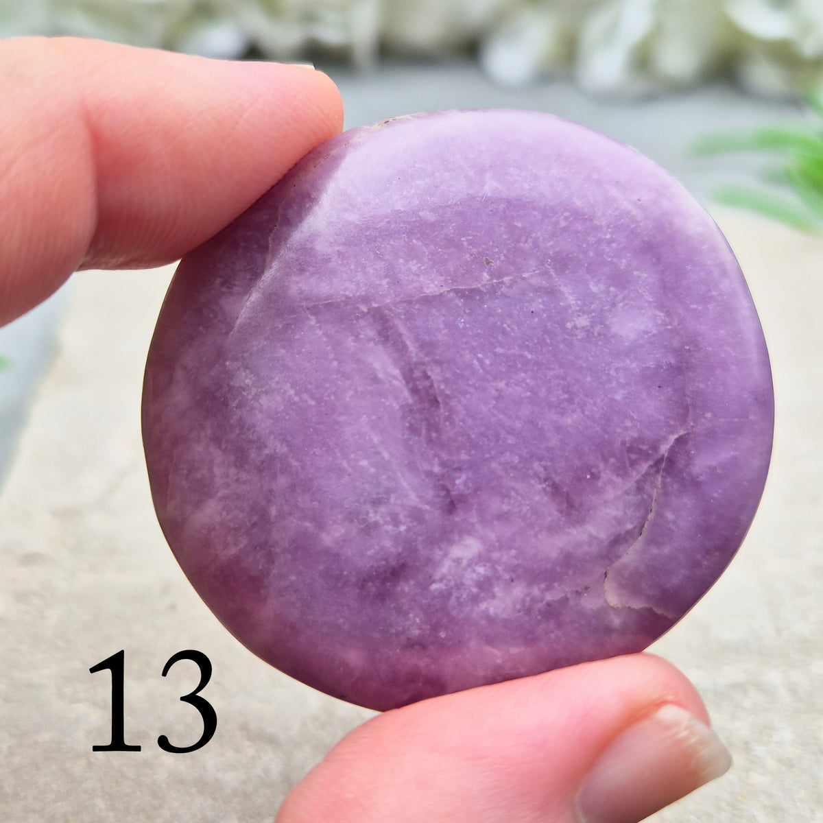 Lepidolite palm stone with calming, balancing energy. Known for easing stress and emotional overwhelm. Smooth, soothing, and ideal for daily support.
