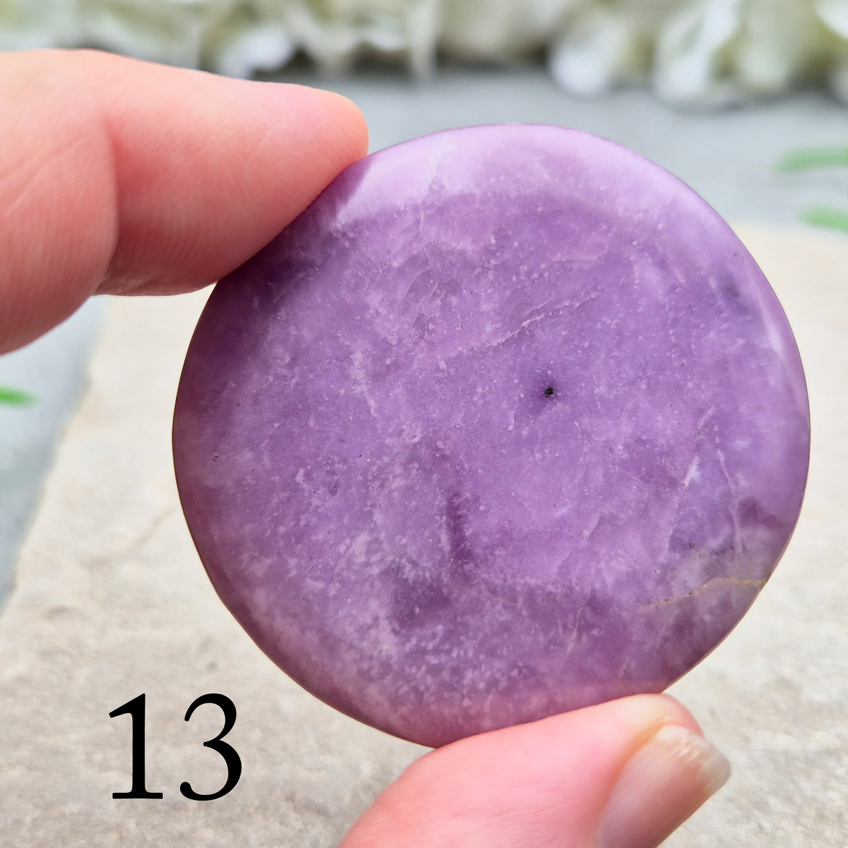 Lepidolite palm stone with calming, balancing energy. Known for easing stress and emotional overwhelm. Smooth, soothing, and ideal for daily support.