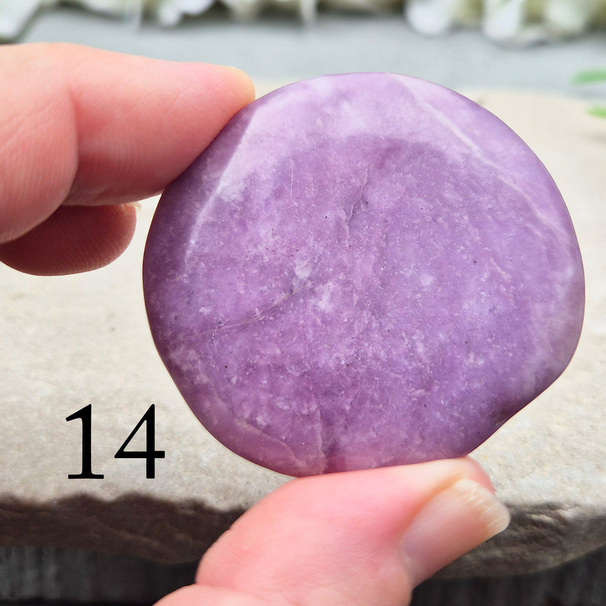 Lepidolite palm stone with calming, balancing energy. Known for easing stress and emotional overwhelm. Smooth, soothing, and ideal for daily support.