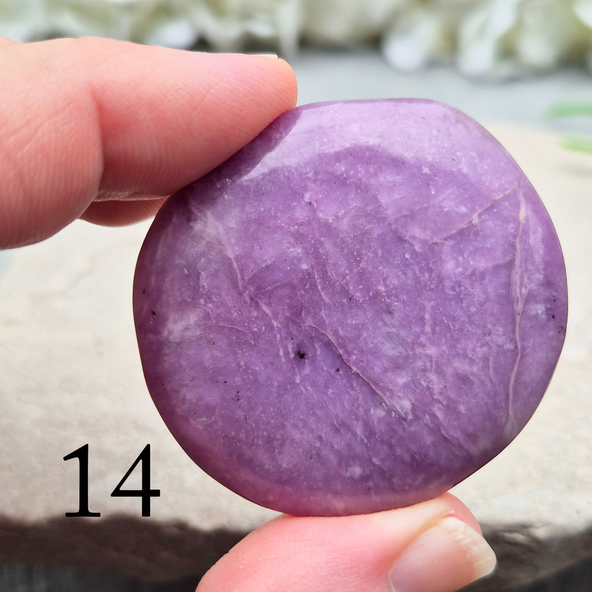Lepidolite palm stone with calming, balancing energy. Known for easing stress and emotional overwhelm. Smooth, soothing, and ideal for daily support.