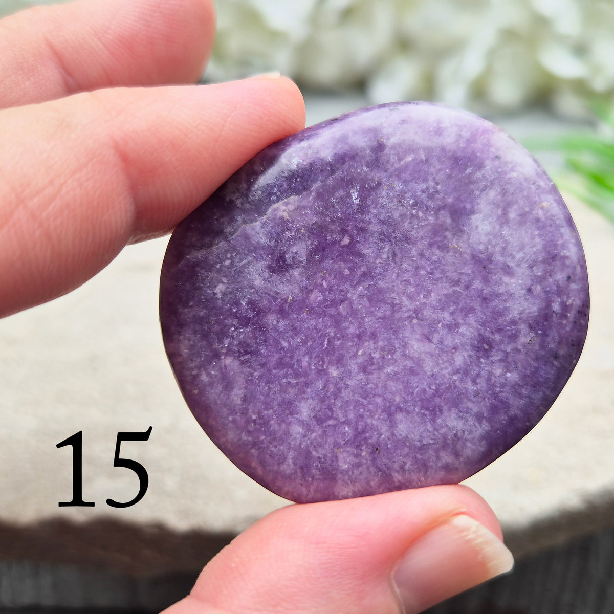 Lepidolite palm stone with calming, balancing energy. Known for easing stress and emotional overwhelm. Smooth, soothing, and ideal for daily support.