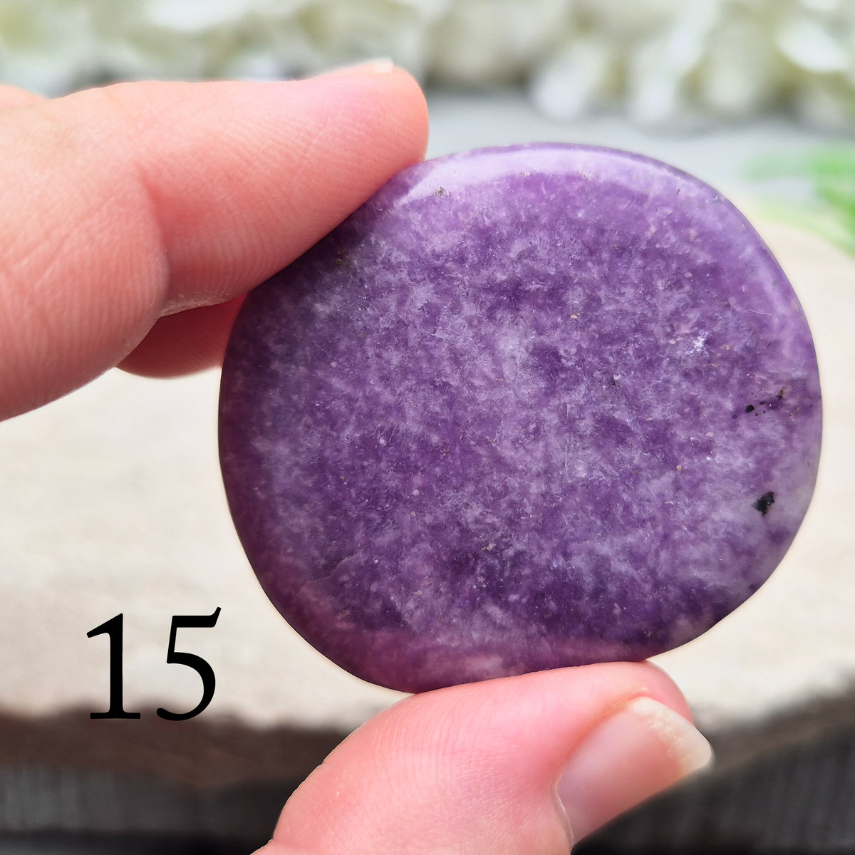 Lepidolite palm stone with calming, balancing energy. Known for easing stress and emotional overwhelm. Smooth, soothing, and ideal for daily support.