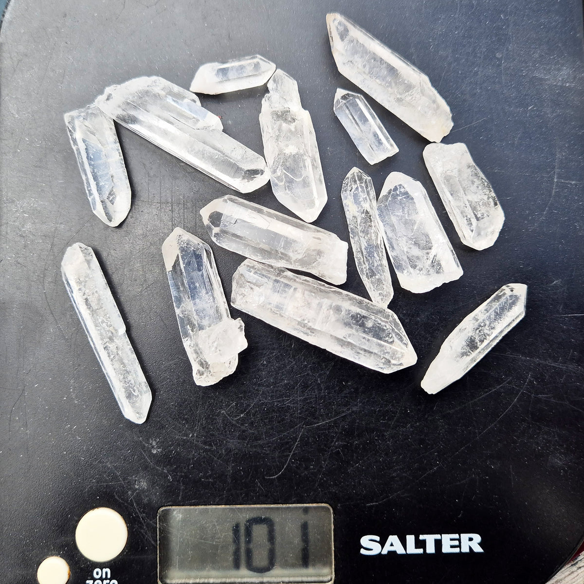 Shop natural mini clear quartz points, 100g of assorted sizes. Known for clarity, focus and amplifying intention — perfect starter crystals or thoughtful gifts.