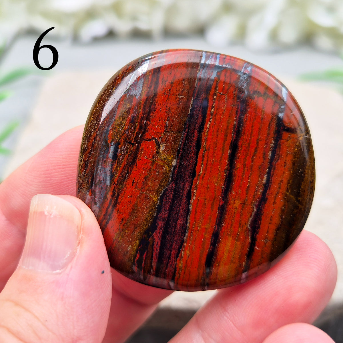 Composite Mugglestone palm stone combining Tiger Eye, Hematite & Red Jasper. Grounding, protective energy supporting focus, strength, and balance.