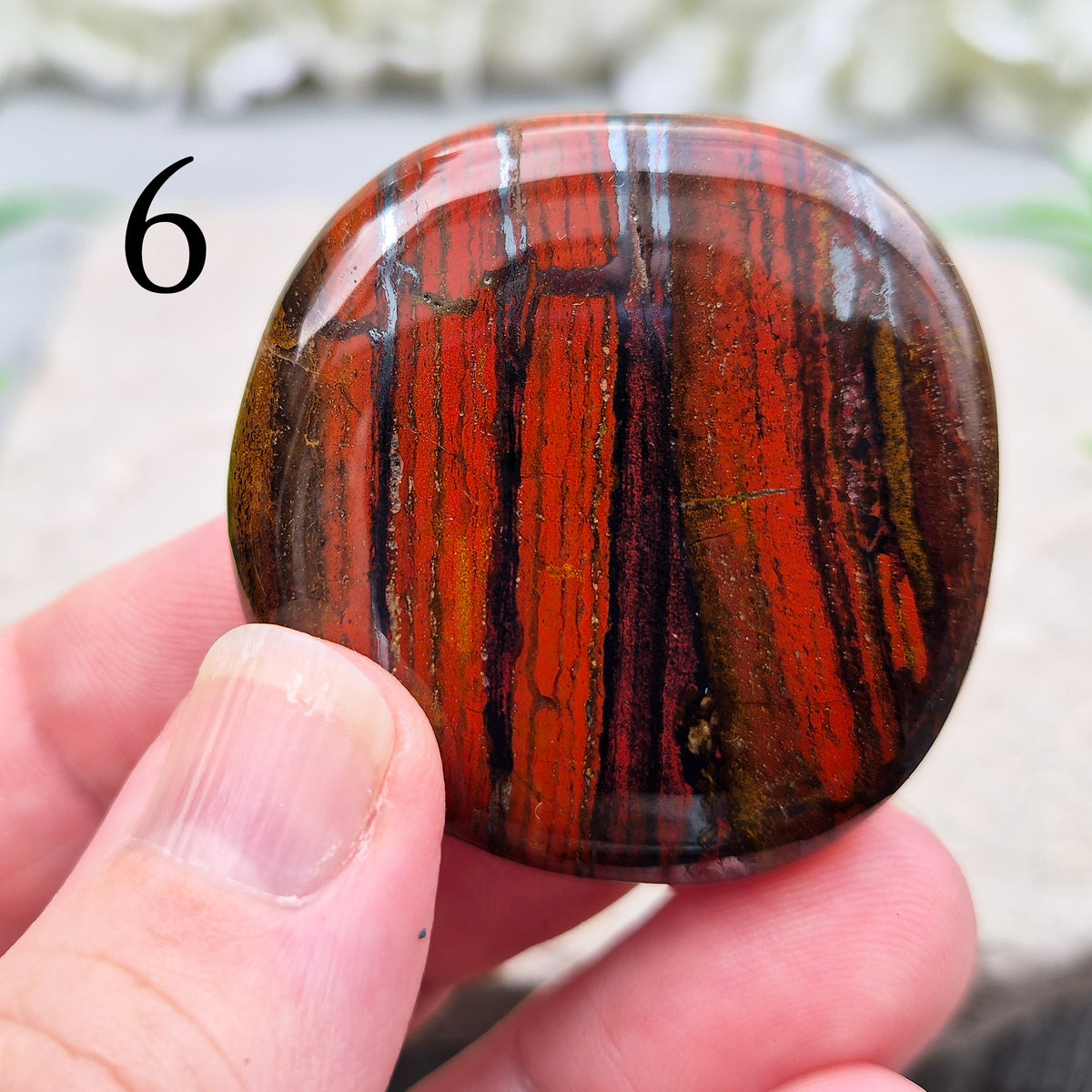 Composite Mugglestone palm stone combining Tiger Eye, Hematite & Red Jasper. Grounding, protective energy supporting focus, strength, and balance.