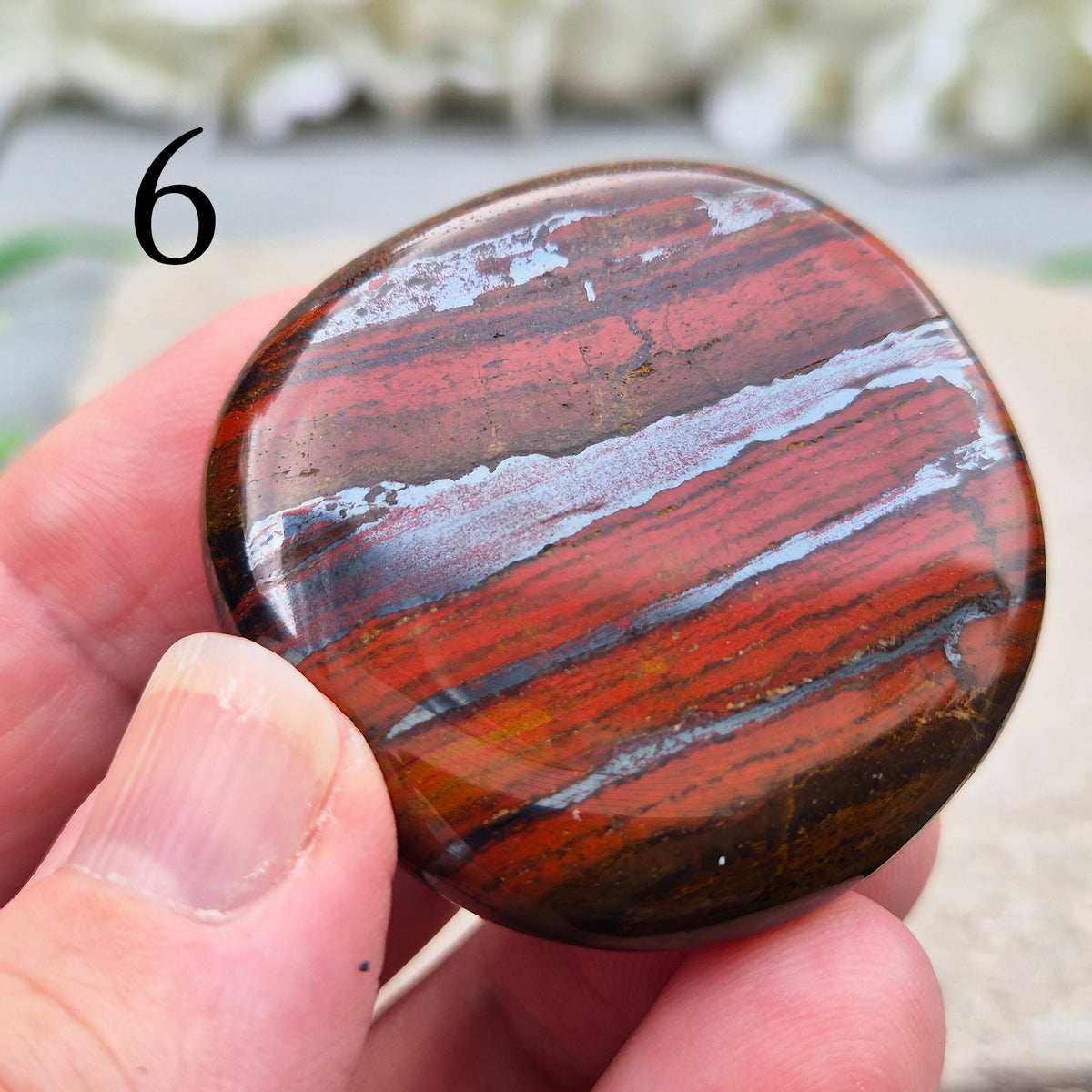 Composite Mugglestone palm stone combining Tiger Eye, Hematite & Red Jasper. Grounding, protective energy supporting focus, strength, and balance.