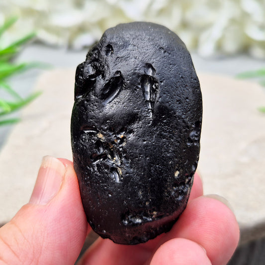 Natural Black Tektite to strengthen grounding, release blockages, and support personal growth. Ideal for energy work and transformation.